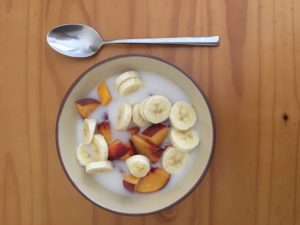 Brown rice flour milk, bananas, chopped peaches and honey